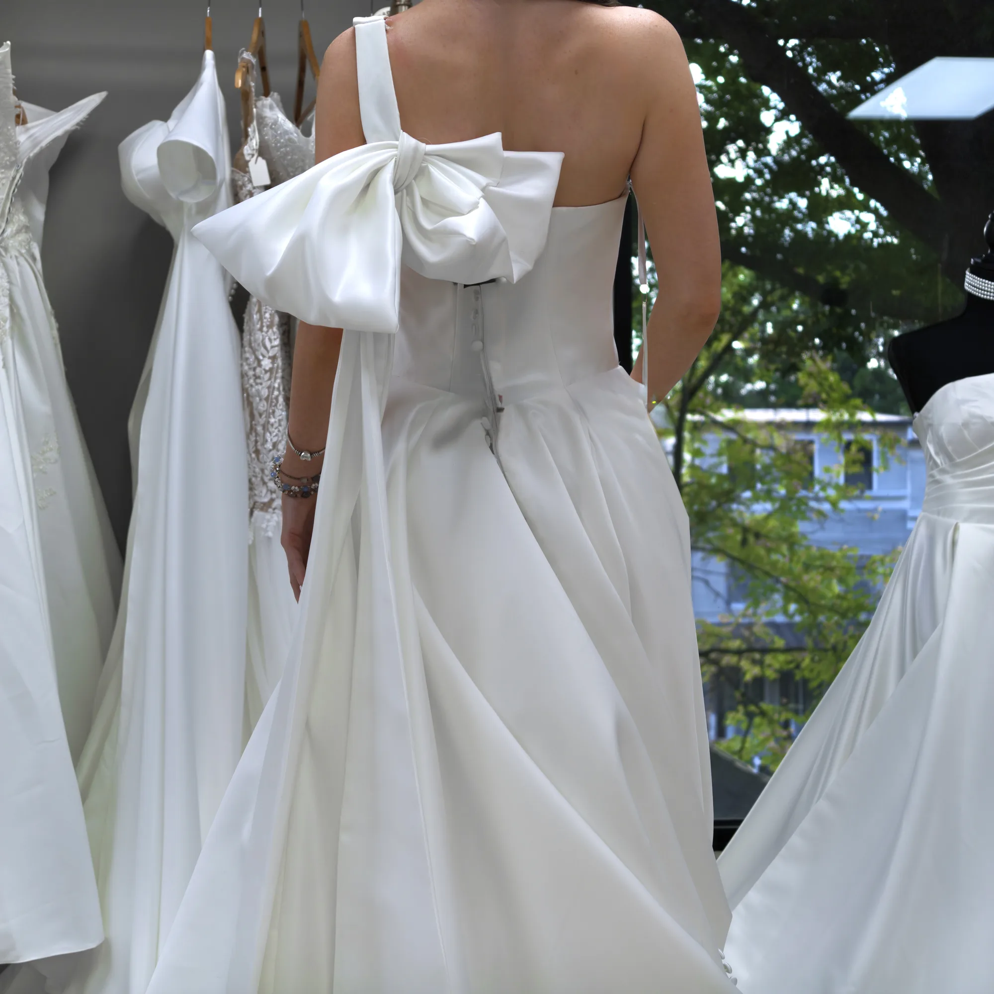 The sculpted satin bow on Adelaide, an exclusive Laurel and Lace wedding gown