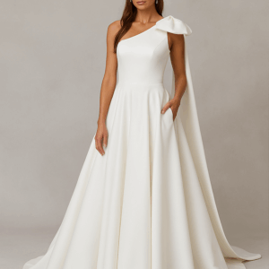 Adelaide satin wedding dress with statement bow and chapel train displayed on mannequin, side view, Laurel&Lace bridals boutique