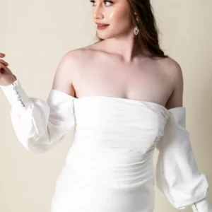 Katherine satin wedding dress with off-shoulder neckline, detachable bishop sleeves, and button train – front view