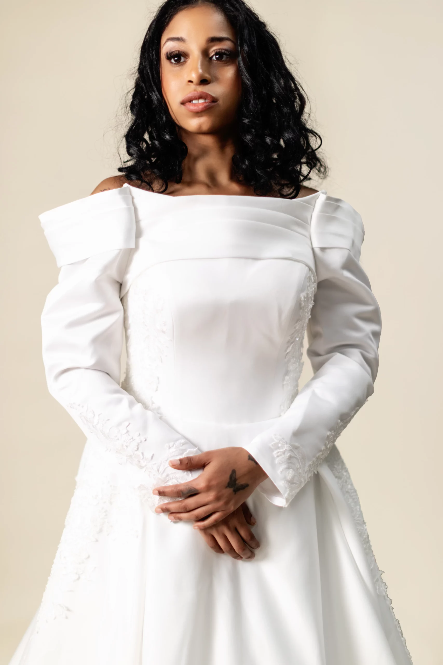 Close-up of structured neckline and long sleeves – Diana gown