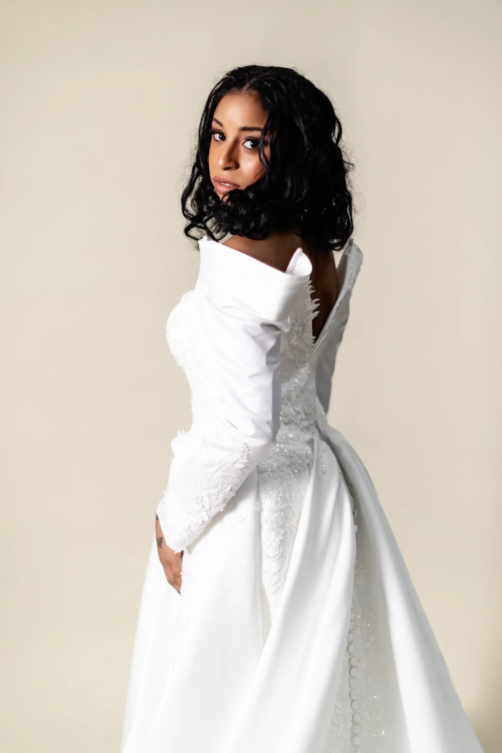 Side view showing lace appliqué and ball gown volume