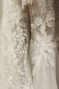 Luxury bridal boutique interior featuring 2 elegant wedding gowns on display at Laurel & Lace in Atlanta